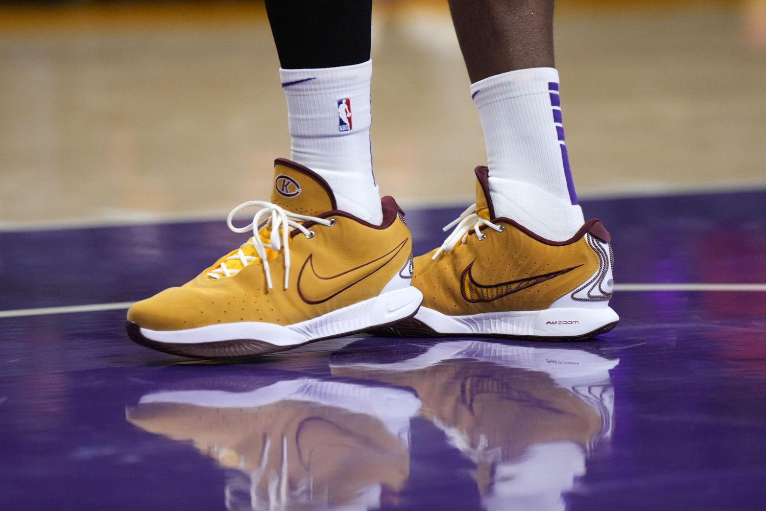 Los Angeles Lakers forward LeBron James's gold and maroon Nike sneakers.